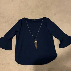 Navy blue blouse with flare sleeves and necklace